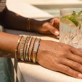 Graduated Bezel Diamond With Gold Disc Bracelet