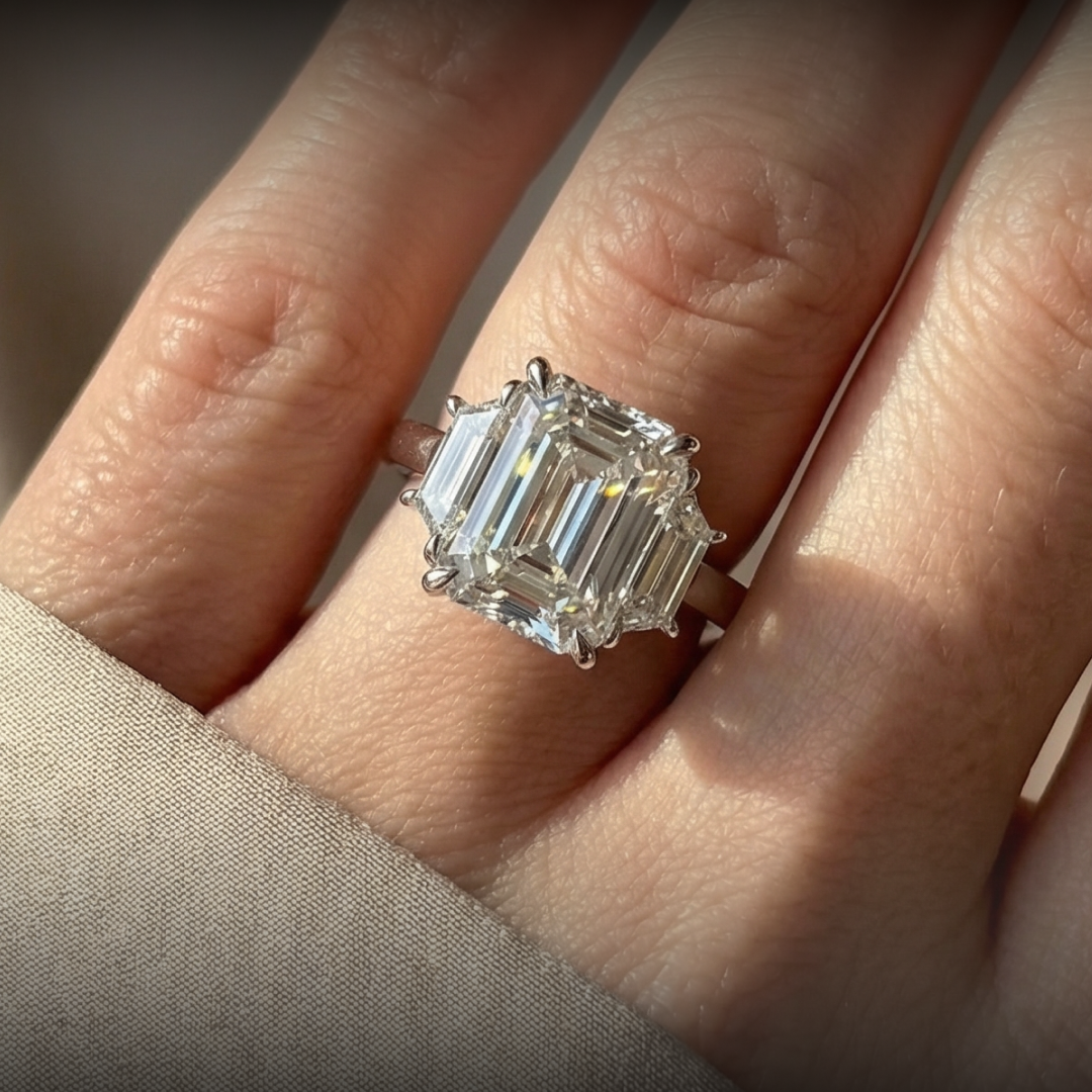 Customized Platinum Emerald Cut With Trapezoid Diamond Accents Ring.