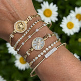 Partial Bezel Set Diamond And Disc Bracelet